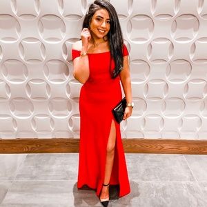 Off shoulder red dress.